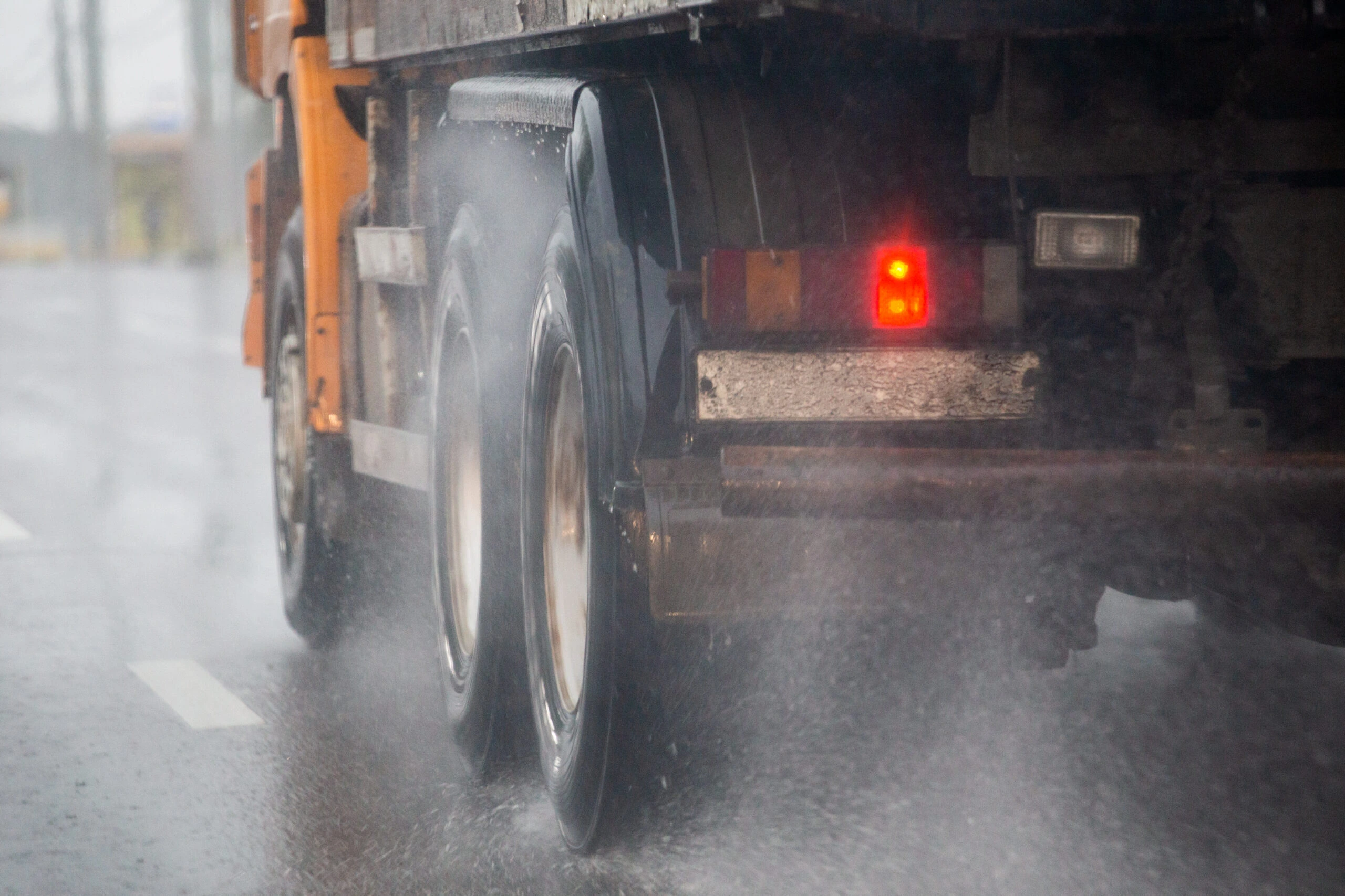 Are Trucks Legally Required to Slow Down in the Rain?